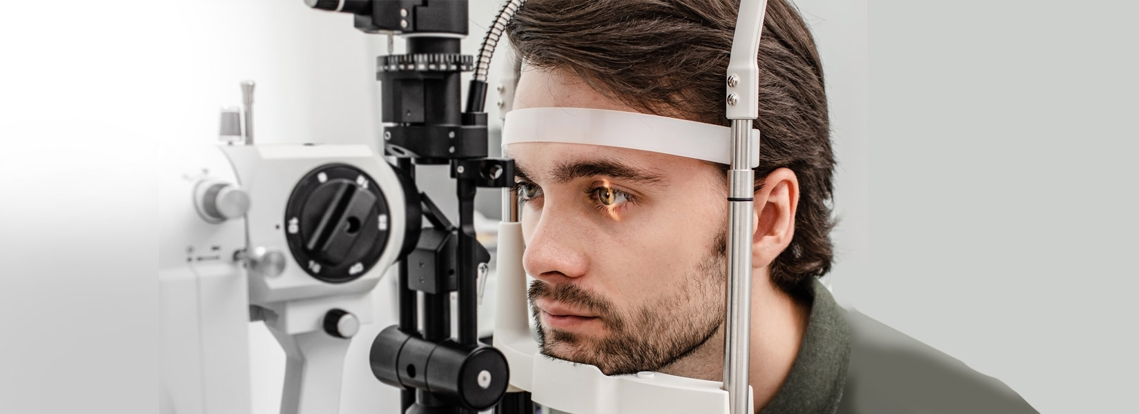 young man during eye exam in Original Town North